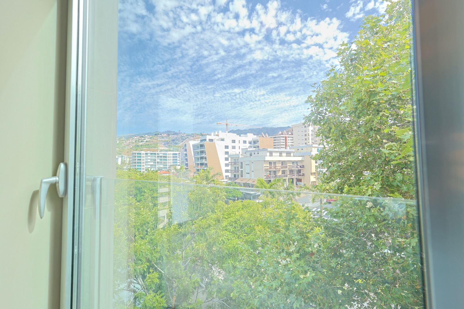 View from the apartment window towards the surrounding buildings of São Martinho, Funchal