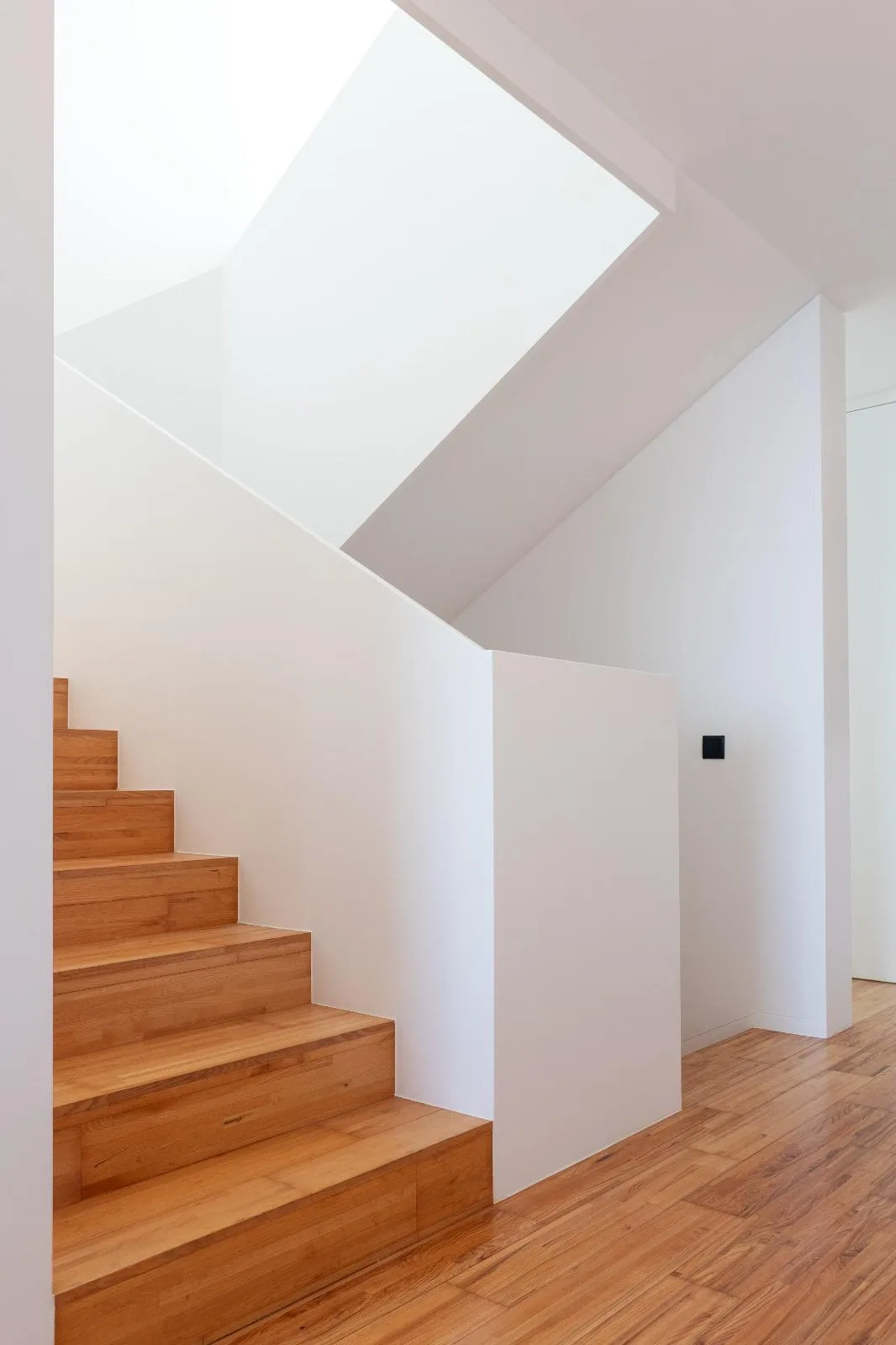Internal staircase in wood connecting the levels of Casa Branca, Funchal