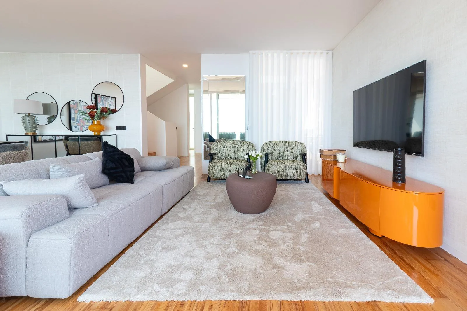Living room with corner sofa, television wall and sea-facing glazing, Casa Branca, Funchal