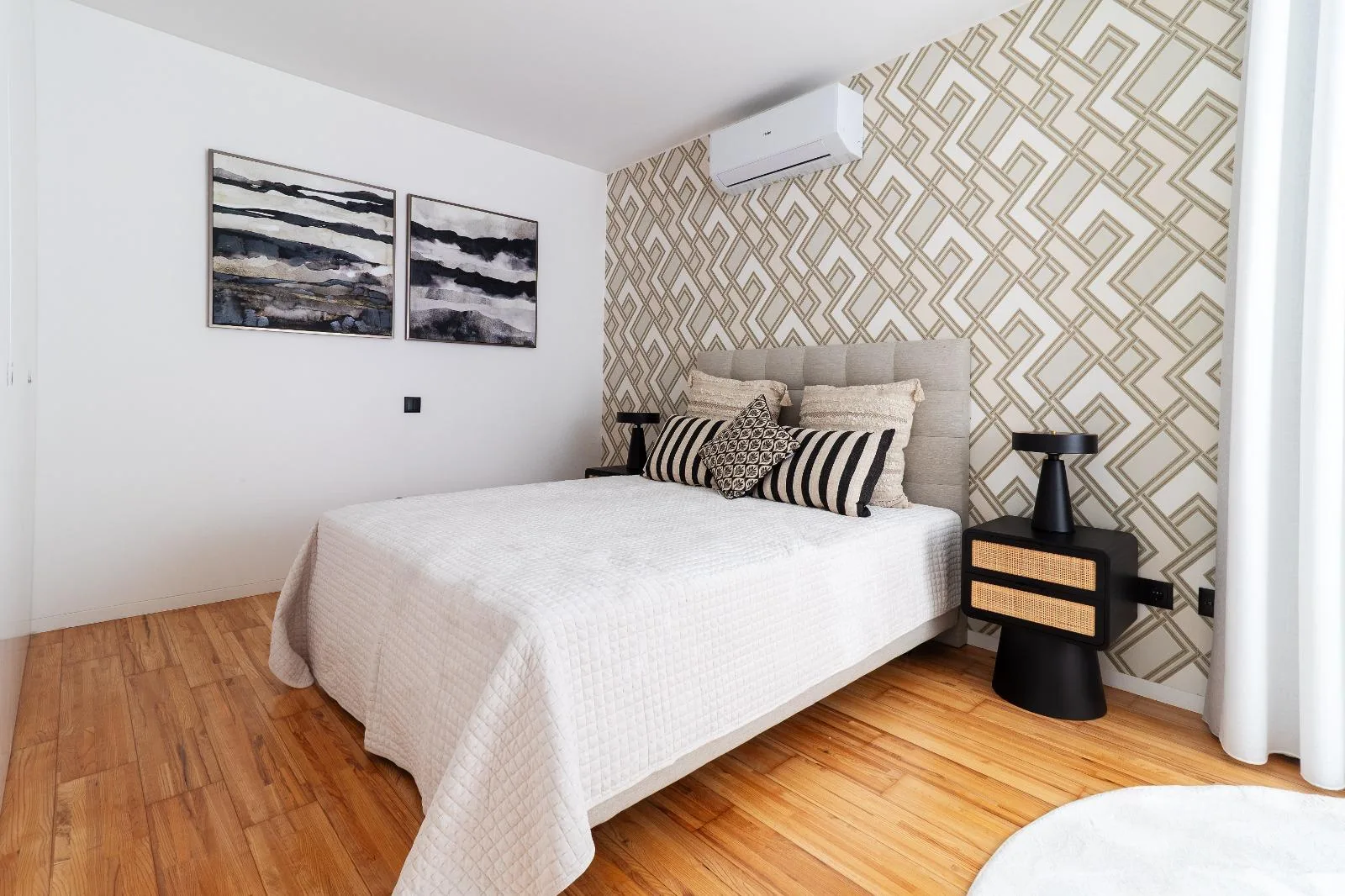Bedroom with patterned feature wall and wooden floor, Casa Branca, Funchal